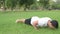 Young handsome Hispanic man doing push up in the park outdoors