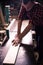 Young handsome joiner working with wood in his carpentry workshop