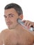 Young handsome male shaving face beard