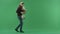 Young handsome male walks with pile of Xmas presents, green chroma key background