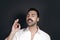 Young handsome man with beard and mustache studio portrait