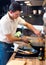 Young handsome man preparing lunch