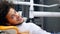 A young handsome man sitting in a dentists chair, he turns and smiles into camera