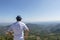 Young handsome man travel back view in mountains, caucasian male traveler in Provence in Vaucluse, France