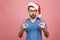 Young handsome man wearing christmas hat over isolated pink background smiling positive doing ok sign with hand and fingers.
