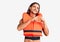 Young handsome man wearing nautical lifejacket smiling in love doing heart symbol shape with hands