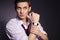 Young handsome men in suit shirt and red tie wear watches looking up. dark background. indoors. copy space