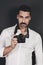 Young handsome photographer with beard and mustache studio portrait