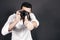 Young handsome photographer with beard and mustache studio portrait