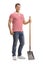 Young handsome posing man with a shovel