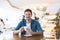 Young handsome smiling man drinks coffee during his lunch break in the cafe, positive vibes