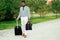 Young and handsome stylish model afro- american man in a stylish suit in a summer park latino hispanic businessman black