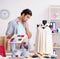 Young handsome tailor working in his workshop