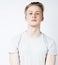 Young handsome teenage hipster guy posing emotional, happy smiling against white background isolated, lifestyle people