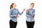 Young handsome woman arguing with herself on white studio background.