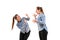 Young handsome woman arguing with herself on white studio background.