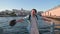 A young, handsome young man in white shorts and a light blue shirt is enjoying a sunny day in Istanbul. A tourist with light