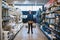 Young handyman posing in a hardware store