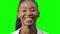 Young Happy African American Black Woman laugh on a green background