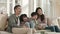 young happy asian family watching tv at home