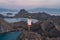 Young happy Asian man traveller standing on top view of Padar island in a morning sunrise, Komodo national park in Flores island,