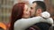 Young happy attractive amorous couple embracing and kissing outdoor. Merry Christmas and new year concept. Good mood and
