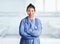 Young happy and attractive Asian Korean medicine doctor woman in blue scrubs smiling cheerful at hospital room bed in health care