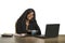 Young happy and attractive black afro American business woman working at office computer desk smiling successful posing corporate