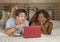 Young happy and attractive multiracial couple with beautiful black afro American ethnicity woman and white man lying relaxed on