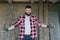 Young happy bearded man hipster carpenter in construction glasse