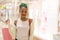 Young happy and beautiful afro American girl at buying shopping mall - lifestyle portrait of millennial black girl enjoying