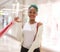 Young happy and beautiful afro American girl at buying shopping mall - lifestyle portrait of millennial black girl enjoying