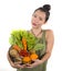 Young happy and beautiful Asian Chinese woman holding basket full of fresh vegetables and fruits smiling cheerful  in healthy