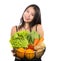 Young happy and beautiful Asian Chinese woman holding basket full of fresh vegetables and fruits smiling cheerful  in healthy