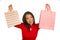 Young happy and beautiful Asian Chinese woman in red dress smiling cheerful holding shopping bags as excited shopaholic girl