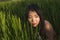 Young happy and beautiful Asian woman enjoying nature at rice field. sweet Chinese girl exploring countryside during holiday