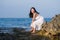Young happy and beautiful Asian woman by the sea - Attractive Korean girl in white dress enjoying relaxed summer holidays at