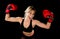 Young happy beautiful boxer girl with boxing gloves arms in victory sign with fit and healthy body