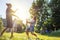 Young happy beautiful couple hosing in the garden, summer happiness and love concept