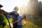 Young happy beautiful couple hosing in the garden, summer happiness and love concept