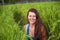 Young happy and beautiful red hair woman smiling playful having fun posing relaxed isolated on green rice field in Asia tourist