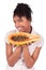 Young happy black / african american woman holding fresh papaya