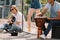 Young happy buskers performing and singing