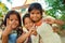 Young, happy Cambodian girls outside the community buildings