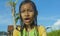 Young happy and carefree beautiful child 7 or 8 years old outdoors having shower at a beautiful rice terrace playful under the