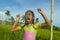 Young happy and carefree beautiful child 7 or 8 years old outdoors having shower at a beautiful rice terrace playful under the