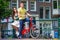 Young happy caucasian couple on bikes in old