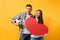 Young happy cheerful couple supporter, woman man, football fans cheer up support team, holding red heart love, soccer