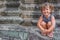 Young happy child girl, smiling portrait, Angkor wat, cambodia