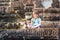 young happy child girl tourist meditating in angkor wat, cambodia